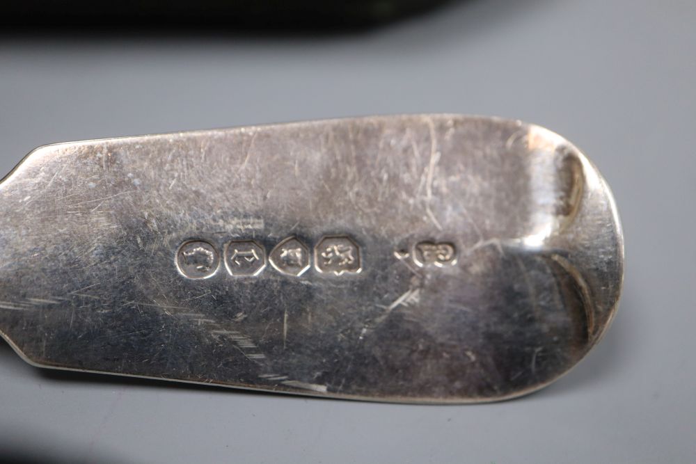 A cased pair of fancy silver serving spoons by George Adams, London, 1857 and a silver fish slice